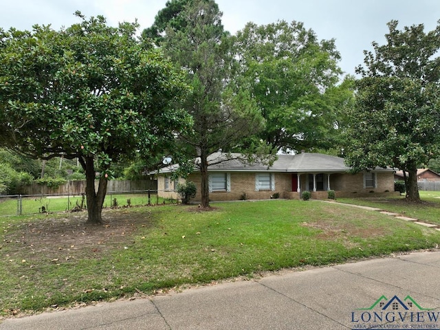 ranch-style home with a front yard