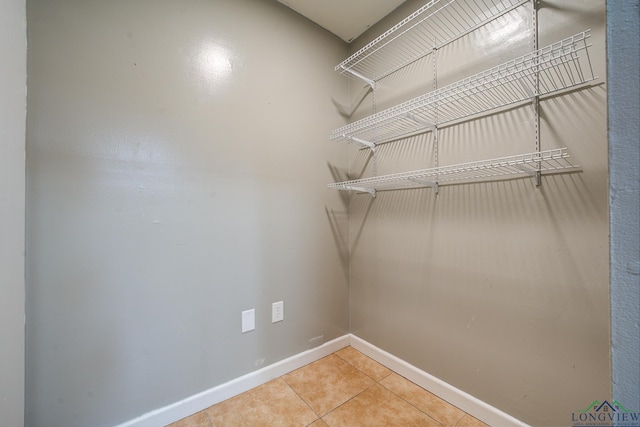 spacious closet featuring tile patterned floors