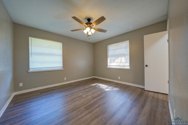 unfurnished room with a textured ceiling, ceiling fan, and dark hardwood / wood-style floors