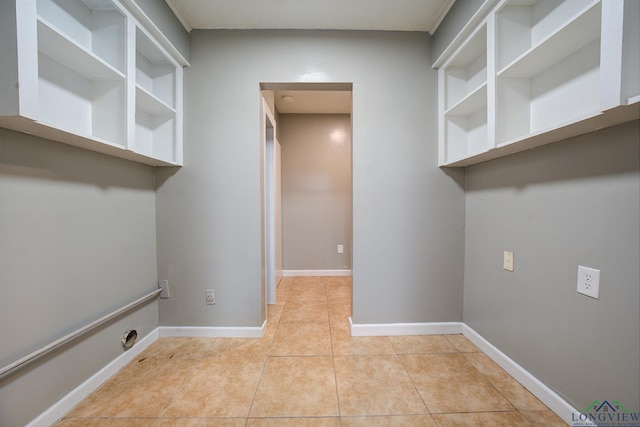 laundry room featuring light tile patterned floors