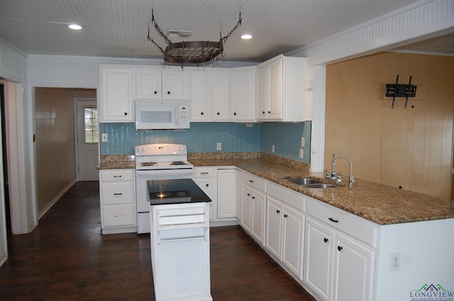 kitchen featuring kitchen peninsula, sink, white cabinets, and white appliances