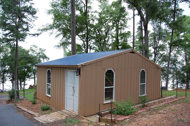 view of outbuilding featuring a garage