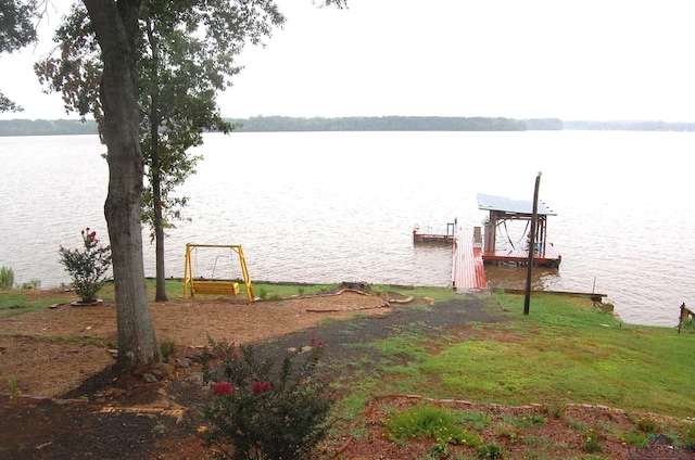 dock area with a water view