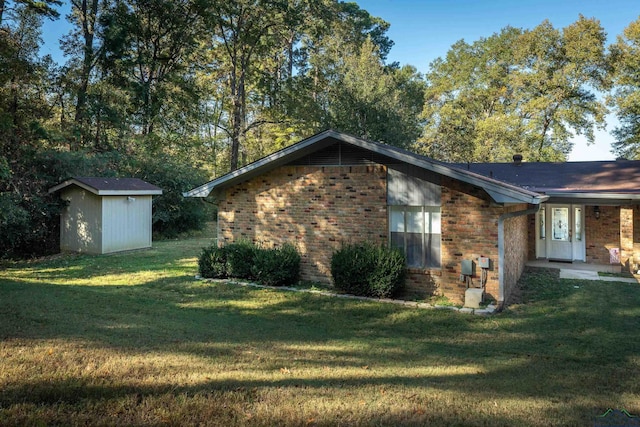 view of property exterior with a yard and a storage shed