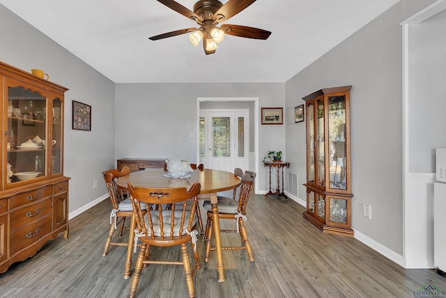 dining space featuring ceiling fan and light hardwood / wood-style floors