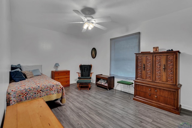 bedroom featuring hardwood / wood-style flooring and ceiling fan