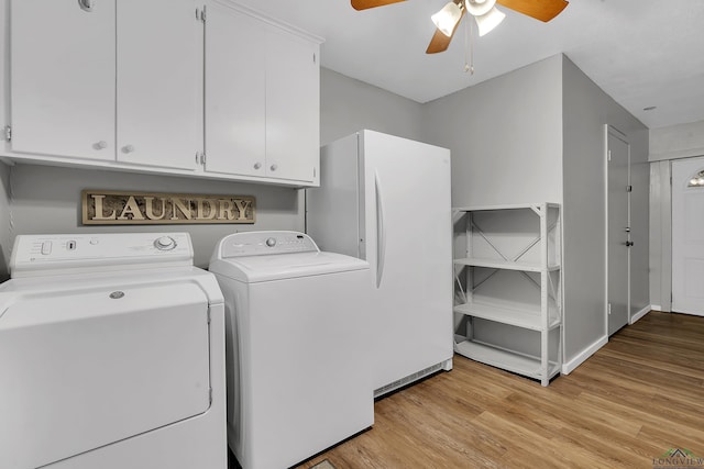 clothes washing area featuring cabinets, light hardwood / wood-style floors, washer and clothes dryer, and ceiling fan