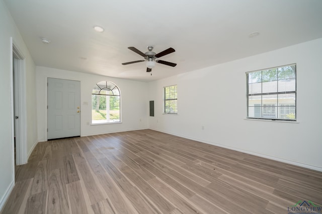 spare room with ceiling fan and light hardwood / wood-style flooring