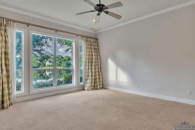 1719 Hg Mosley Pkwy, Longview, TX 75604 - empty room featuring carpet, baseboards, ceiling fan, and ornamental molding