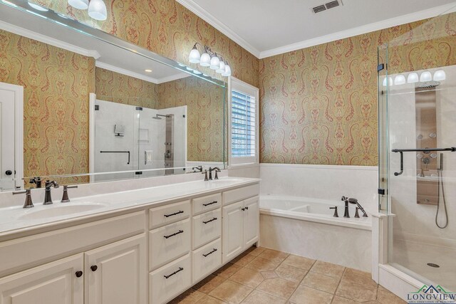 1719 Hg Mosley Pkwy, Longview, TX 75604 - bathroom featuring a shower stall, a garden tub, double vanity, ornamental molding, and wallpapered walls
