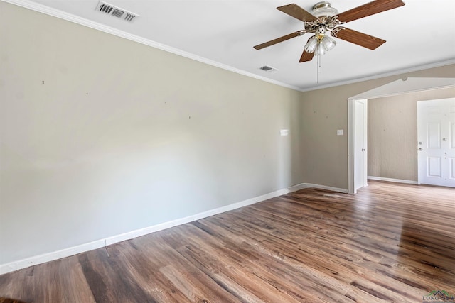 spare room featuring wood-type flooring, ceiling fan, and ornamental molding