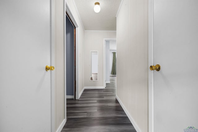 hall featuring dark hardwood / wood-style flooring and a textured ceiling