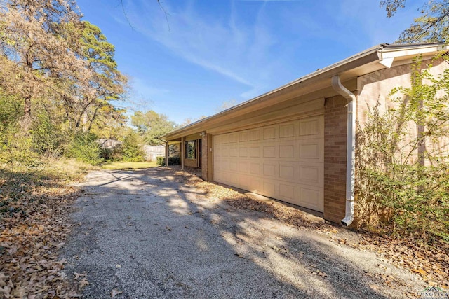 view of home's exterior featuring a garage