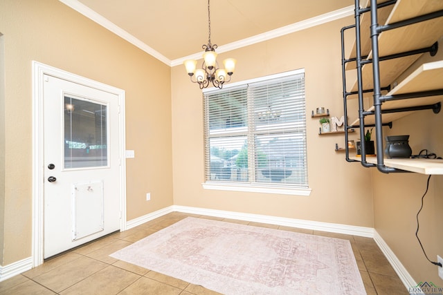 foyer entrance with tile patterned flooring, a chandelier, and ornamental molding