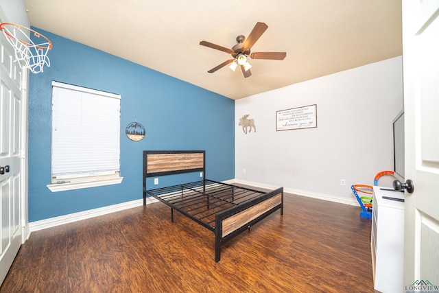 bedroom with ceiling fan and dark hardwood / wood-style flooring