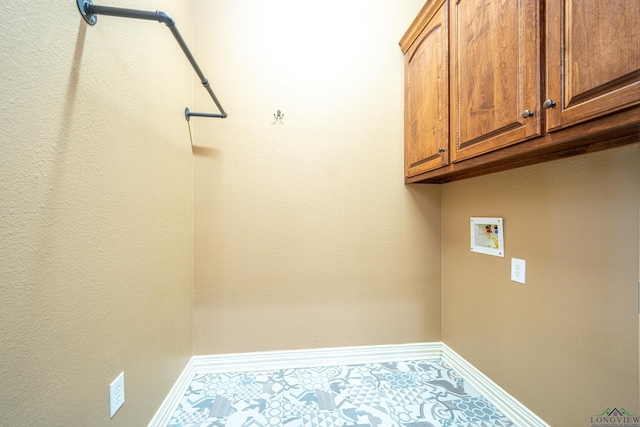 laundry room featuring cabinets and washer hookup