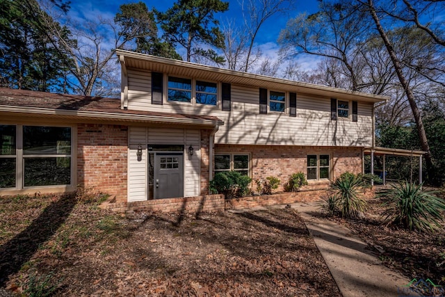 view of front of home featuring brick siding