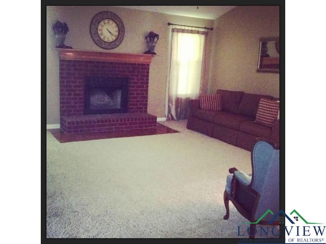 carpeted living room featuring a brick fireplace