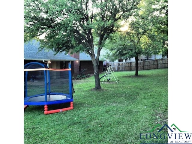 view of yard with a trampoline