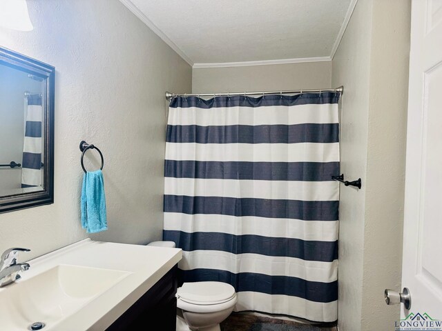 bathroom with a shower with curtain, crown molding, a textured ceiling, toilet, and vanity