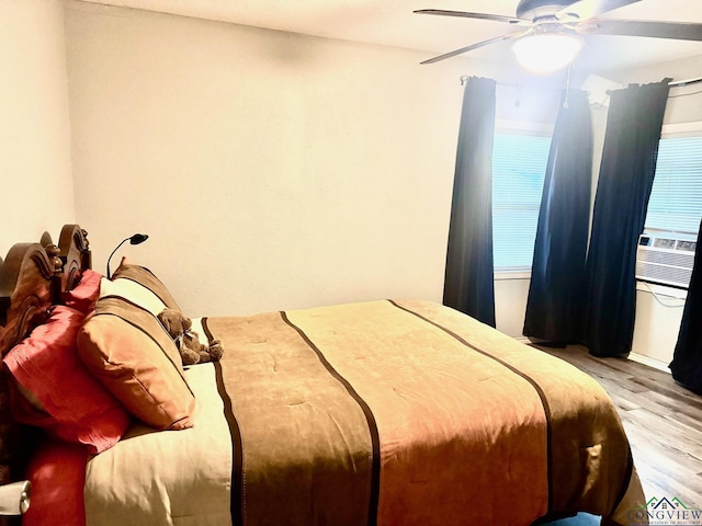 bedroom featuring ceiling fan and light hardwood / wood-style floors