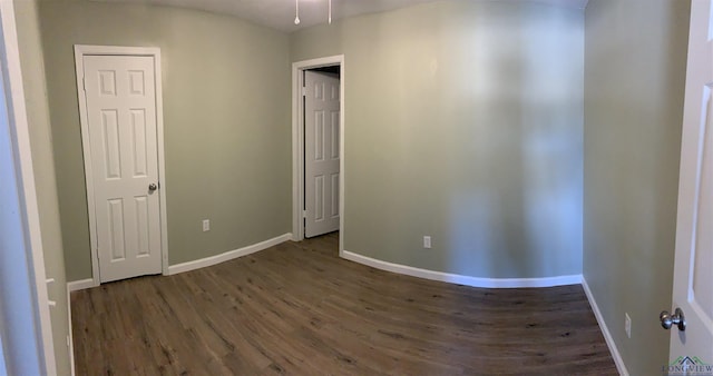 2001 E 20th, Hooks, TX 75561 - empty room featuring dark wood-style flooring and baseboards