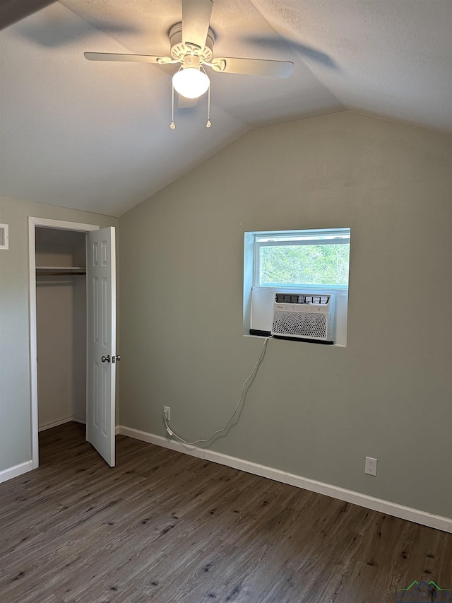 2001 E 20th, Hooks, TX 75561 - unfurnished bedroom with lofted ceiling, cooling unit, wood finished floors, a closet, and baseboards