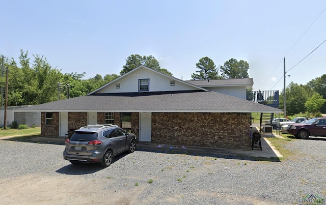 2001 E 20th, Hooks, TX 75561 - view of front of home featuring brick siding and roof with shingles