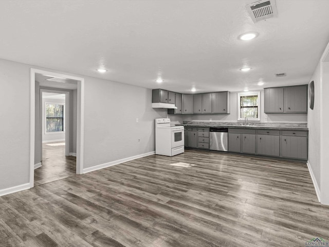 kitchen featuring a sink, dishwasher, gray cabinets, and white electric range