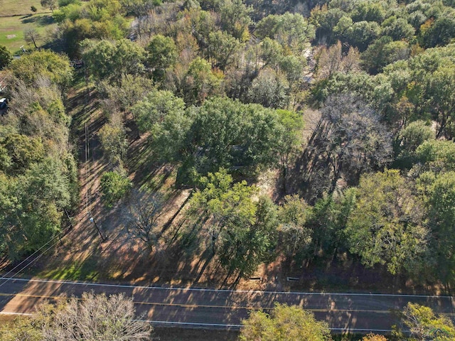 aerial view featuring a wooded view