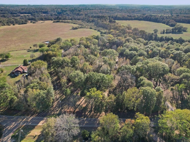 bird's eye view with a rural view and a view of trees