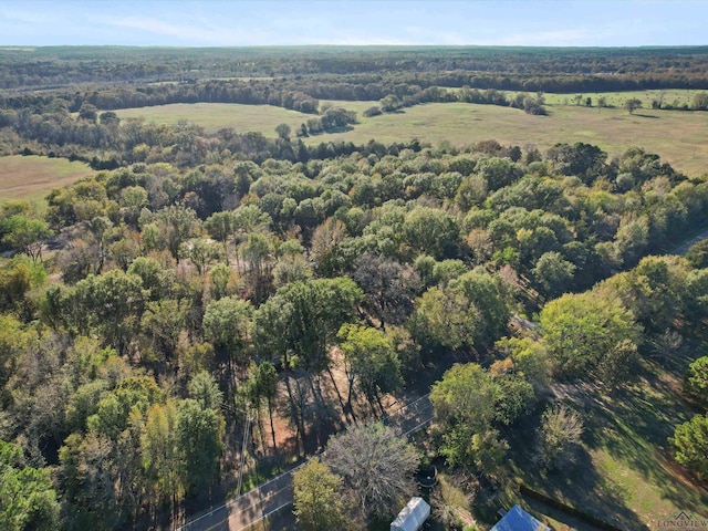 drone / aerial view featuring a forest view