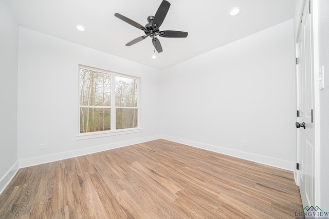 spare room with ceiling fan and light hardwood / wood-style floors