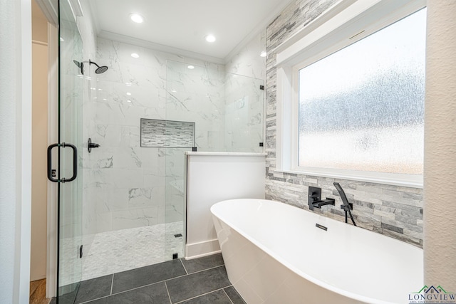 bathroom featuring ornamental molding, tile patterned flooring, and separate shower and tub