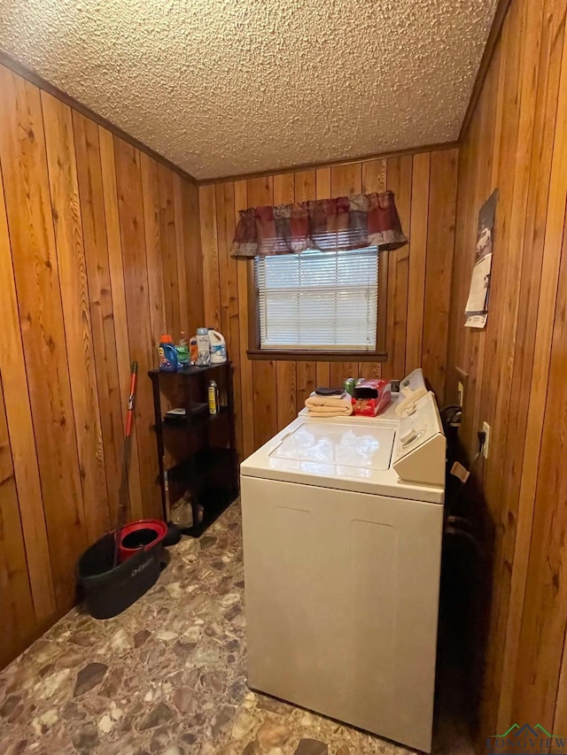 washroom featuring washer / clothes dryer and wooden walls