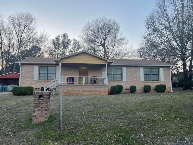 single story home with crawl space, covered porch, brick siding, and a front lawn