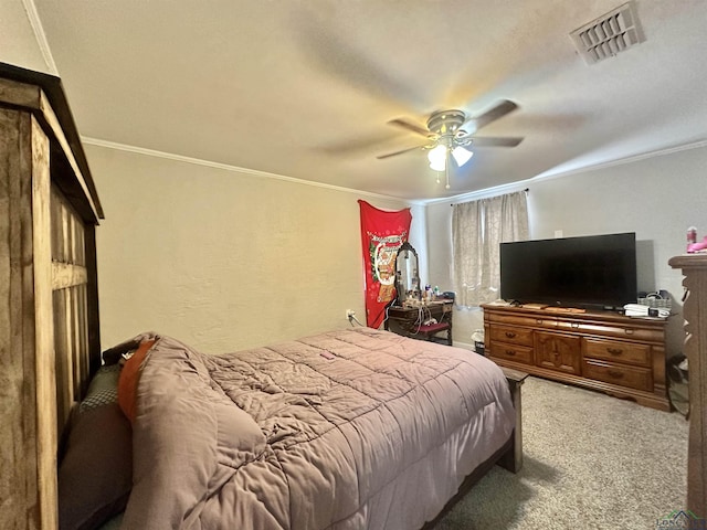 bedroom featuring ceiling fan, carpet floors, and crown molding