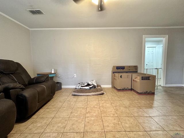 tiled living room featuring ceiling fan and crown molding