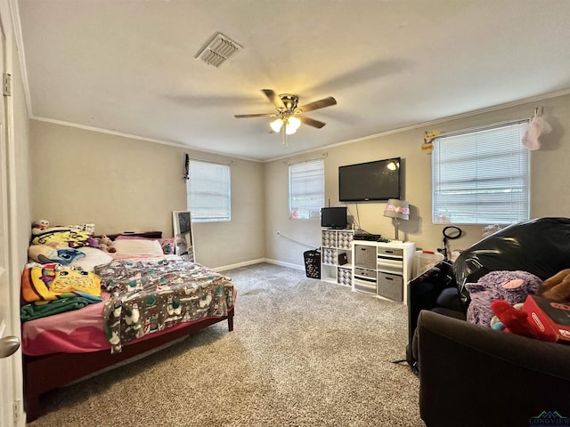 bedroom with ceiling fan, carpet floors, and ornamental molding