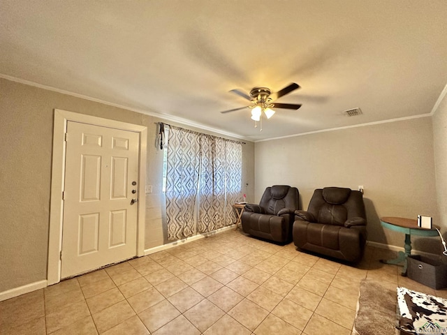 interior space with light tile patterned floors, ceiling fan, and ornamental molding