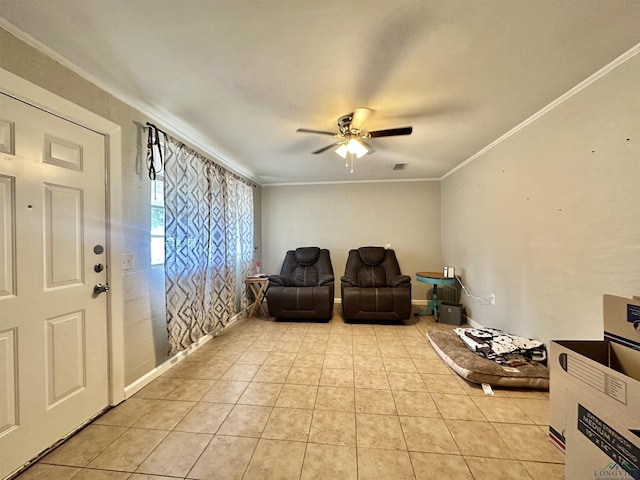 interior space with ceiling fan, light tile patterned floors, and crown molding