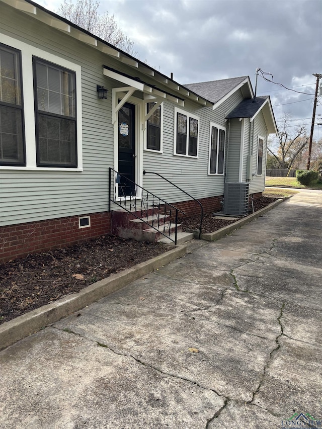 view of front of house featuring central AC unit