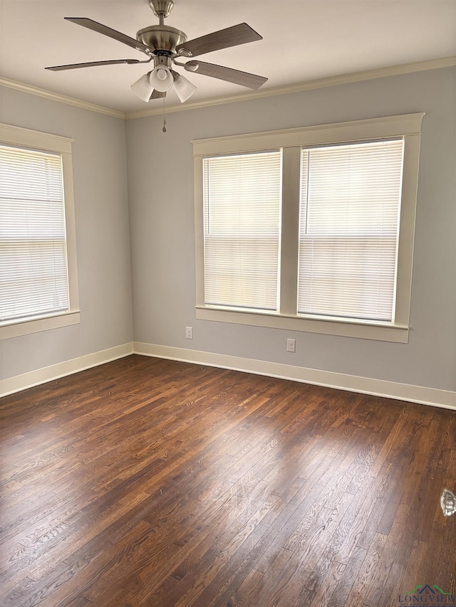 spare room with dark wood-type flooring, ceiling fan, and crown molding