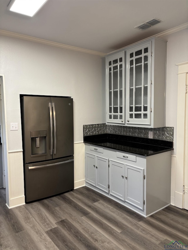 kitchen with white cabinetry, stainless steel fridge with ice dispenser, crown molding, and dark hardwood / wood-style floors