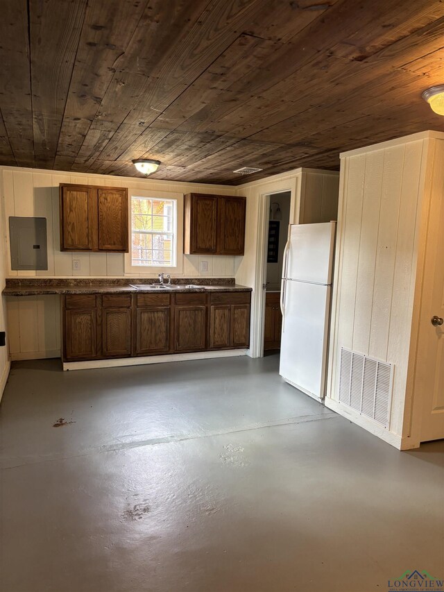 kitchen with sink, electric panel, white fridge, and wood ceiling