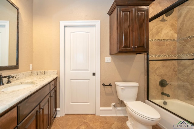 full bathroom featuring tile patterned floors, vanity, toilet, and enclosed tub / shower combo