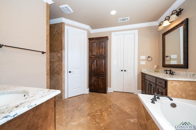 bathroom featuring tiled tub, vanity, and ornamental molding