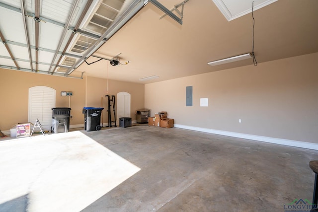 garage featuring a garage door opener and electric panel