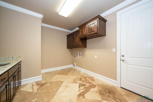 laundry room with cabinets, hookup for a washing machine, electric dryer hookup, crown molding, and sink