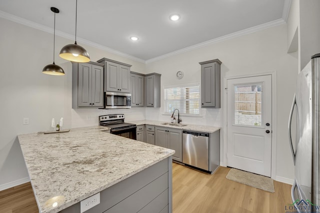 kitchen with gray cabinetry, sink, stainless steel appliances, kitchen peninsula, and decorative light fixtures